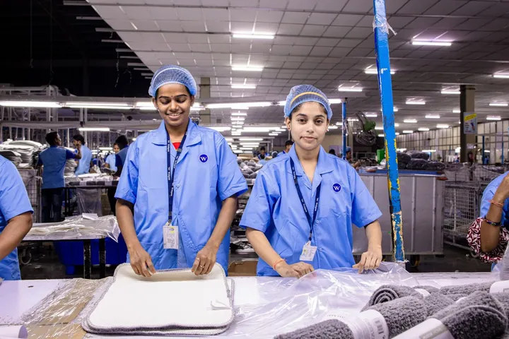 Assembly line workers at a factory