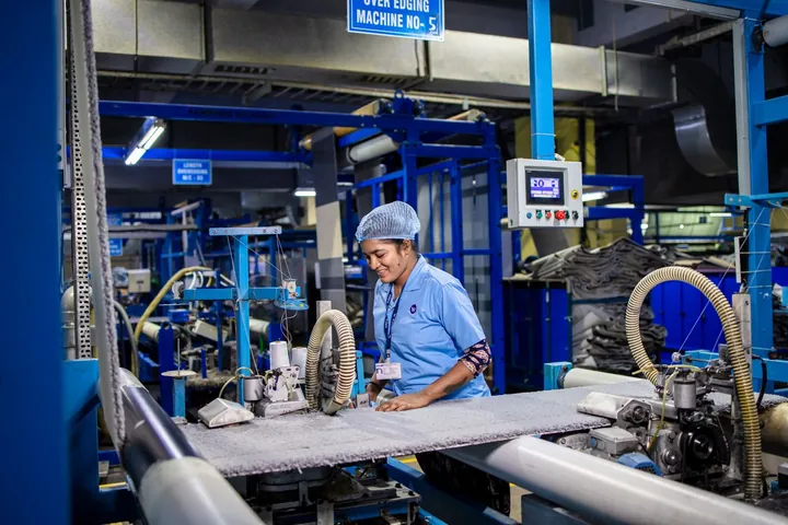 A worker operating industrial machinery
