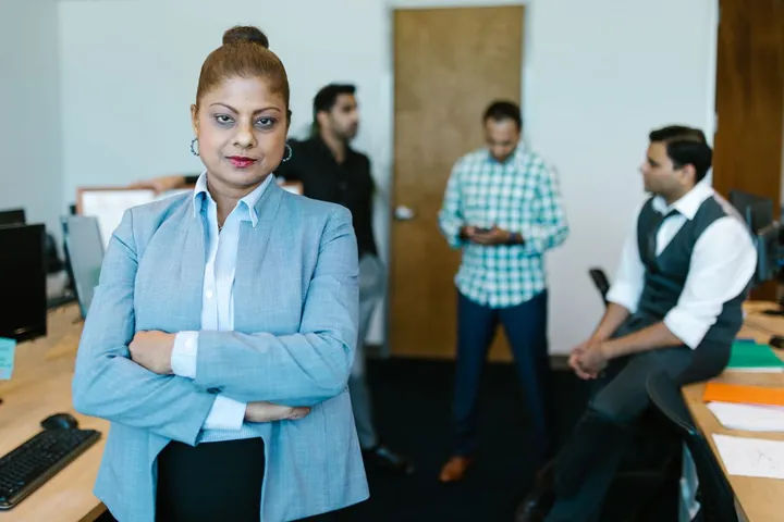 A confident woman professional in an office
